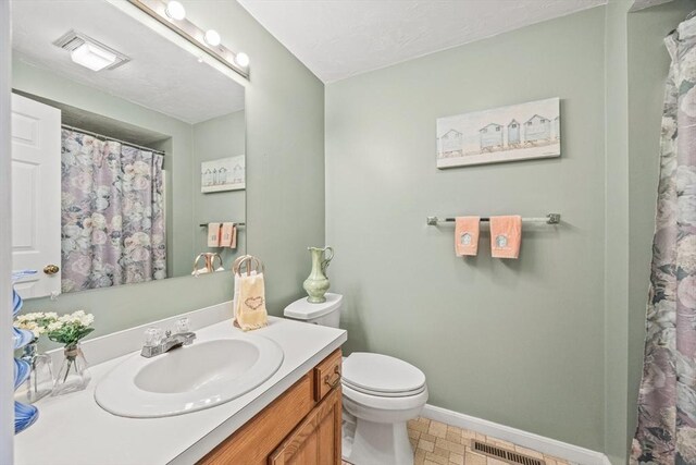 2 Englewood Dr Unit Jl, Harwich, MA 02645 - full bath featuring baseboards, vanity, toilet, and a shower with shower curtain