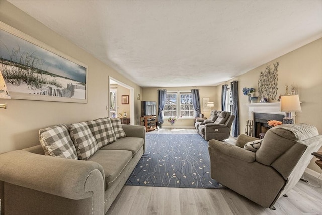 2 Englewood Dr Unit Jl, Harwich, MA 02645 - living room featuring a fireplace and wood finished floors