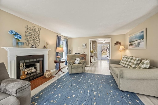 2 Englewood Dr Unit Jl, Harwich, MA 02645 - living room featuring a fireplace with flush hearth and wood finished floors
