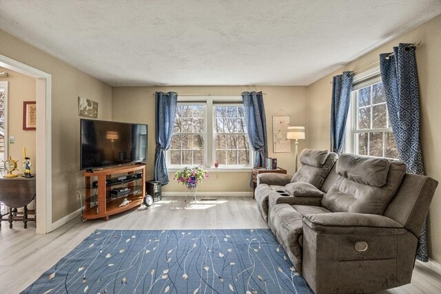 2 Englewood Dr Unit Jl, Harwich, MA 02645 - living area featuring wood finished floors and baseboards