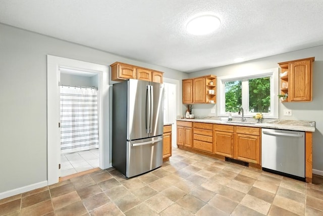 29 Healy St, West Springfield, MA 01089 - kitchen featuring stainless steel appliances, open shelves, light countertops, and a textured ceiling