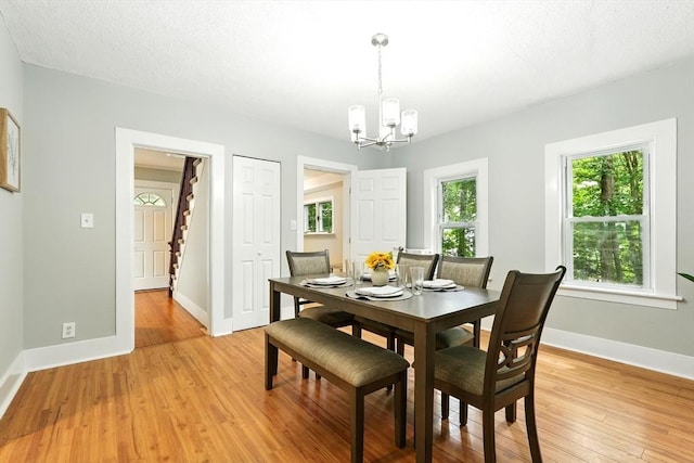 29 Healy St, West Springfield, MA 01089 - dining area featuring stairs, a chandelier, and light wood finished floors