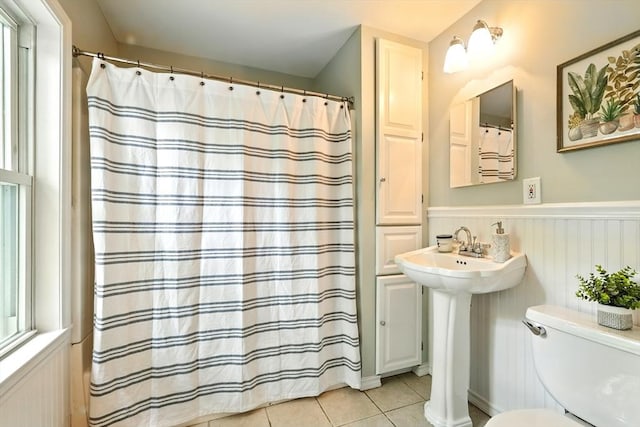 29 Healy St, West Springfield, MA 01089 - bathroom featuring tile patterned flooring, a wainscoted wall, and a shower with shower curtain