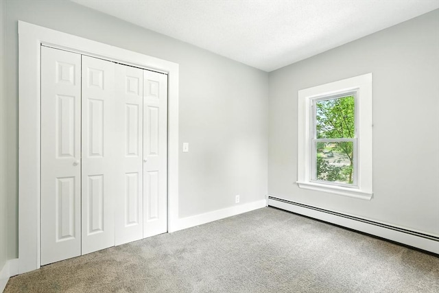 29 Healy St, West Springfield, MA 01089 - unfurnished bedroom featuring a baseboard radiator, carpet flooring, and a closet