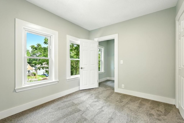 29 Healy St, West Springfield, MA 01089 - carpeted empty room with plenty of natural light