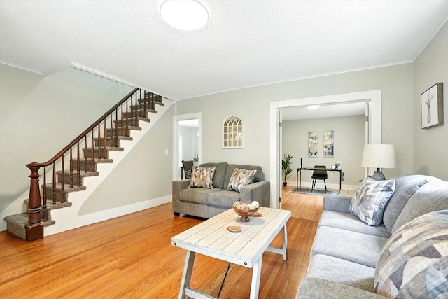 29 Healy St, West Springfield, MA 01089 - living room with stairway, light wood finished floors, and ornamental molding