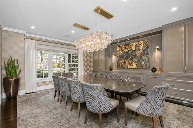 dining area with wood finished floors, crown molding, baseboards, a chandelier, and recessed lighting