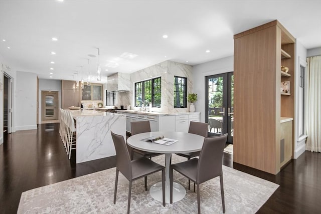 dining space with french doors, plenty of natural light, dark wood-style flooring, and recessed lighting