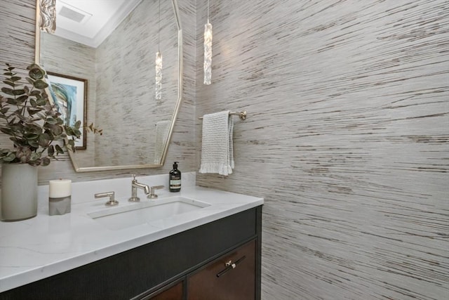 bathroom with a skylight and vanity