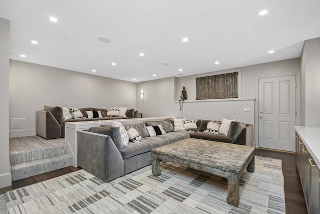 living area with baseboards, recessed lighting, and wood finished floors