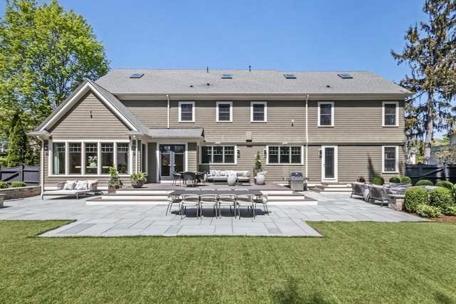 rear view of property featuring a yard, fence, a patio, an outdoor hangout area, and entry steps