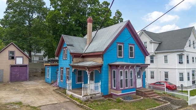 24 N Byron Ave, Brockton, MA 02301 - view of front facade with a chimney and a porch