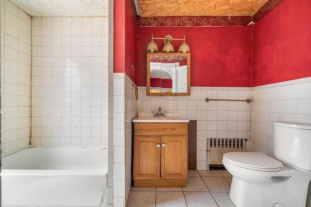24 N Byron Ave, Brockton, MA 02301 - bathroom with radiator, vanity, tile patterned floors, tile walls, and wainscoting
