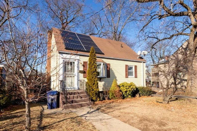 view of front of home featuring solar panels