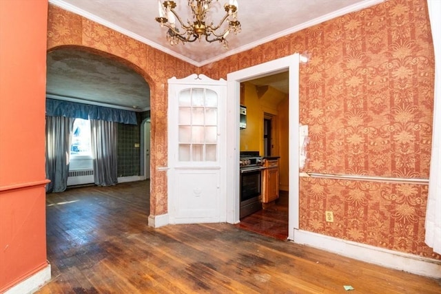 unfurnished dining area featuring crown molding, dark hardwood / wood-style floors, a notable chandelier, and radiator