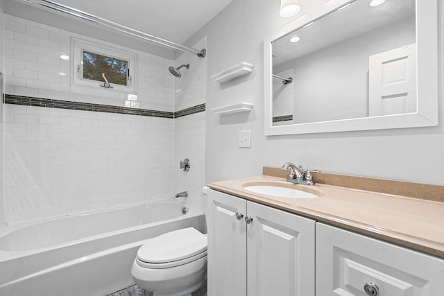 bathroom with toilet, vanity, and bathing tub / shower combination