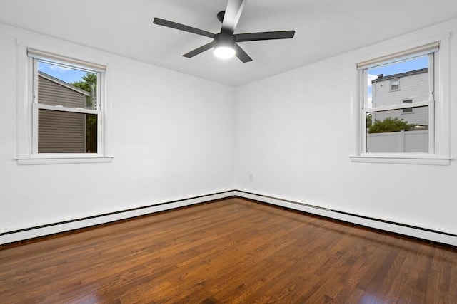 spare room with wood finished floors and a ceiling fan