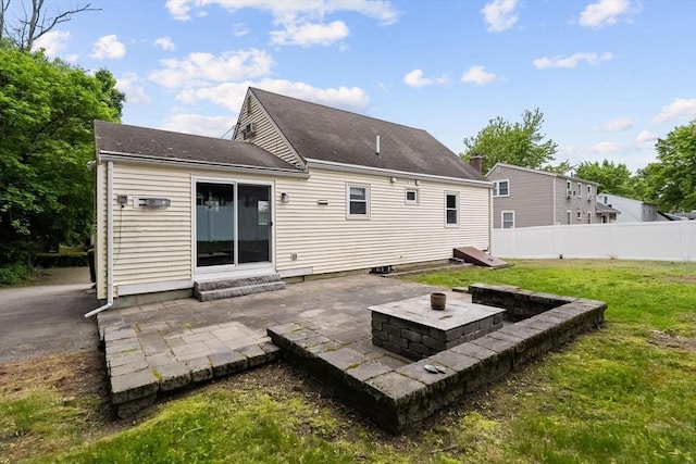 rear view of house with a patio and entry steps
