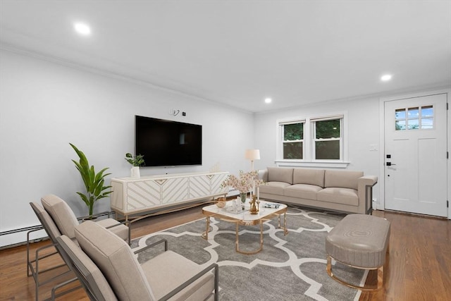 living area featuring wood finished floors, recessed lighting, and ornamental molding