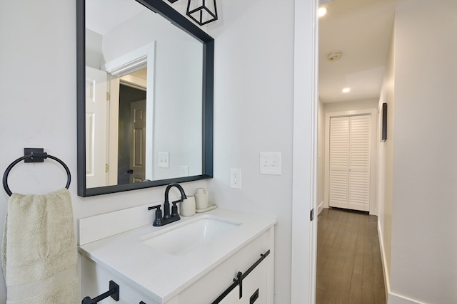 bathroom with vanity and hardwood / wood-style flooring