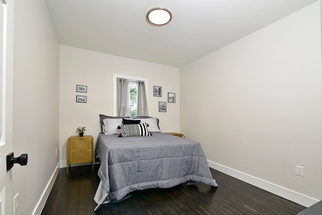 bedroom featuring dark hardwood / wood-style flooring