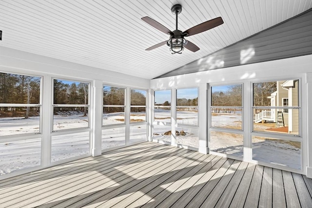 unfurnished sunroom with wood ceiling, a healthy amount of sunlight, and lofted ceiling