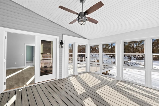 unfurnished sunroom with ceiling fan, vaulted ceiling, and wooden ceiling