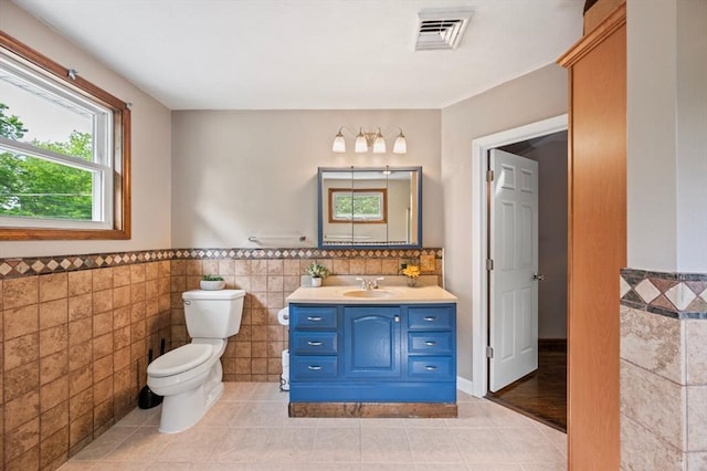 146 Field St, Taunton, MA 02780 - bathroom with tile walls, vanity, tile patterned flooring, and a wainscoted wall