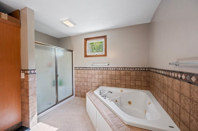 146 Field St, Taunton, MA 02780 - bathroom with tile walls, a stall shower, a jetted tub, wainscoting, and tile patterned flooring