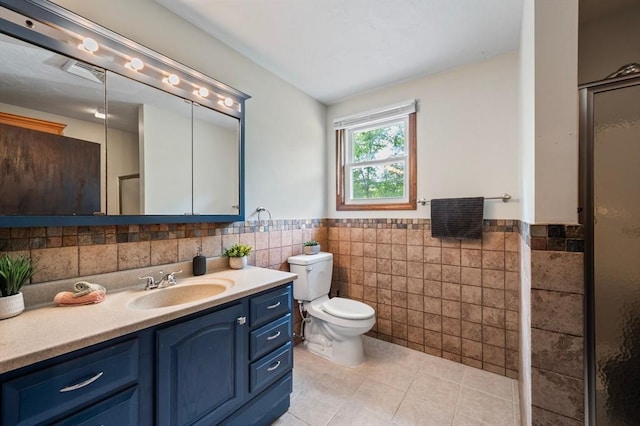 146 Field St, Taunton, MA 02780 - bathroom with tile walls, tile patterned flooring, vanity, wainscoting, and an enclosed shower