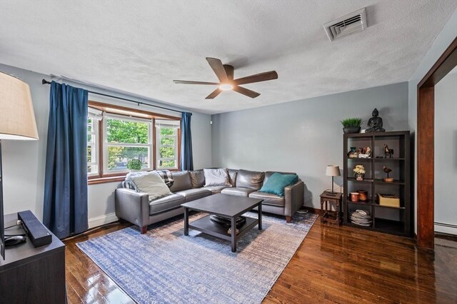 146 Field St, Taunton, MA 02780 - living room with a textured ceiling, a ceiling fan, and wood finished floors