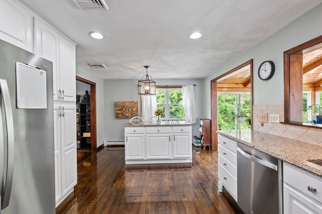 146 Field St, Taunton, MA 02780 - kitchen featuring stainless steel appliances, dark wood-style floors, light stone countertops, a baseboard radiator, and recessed lighting