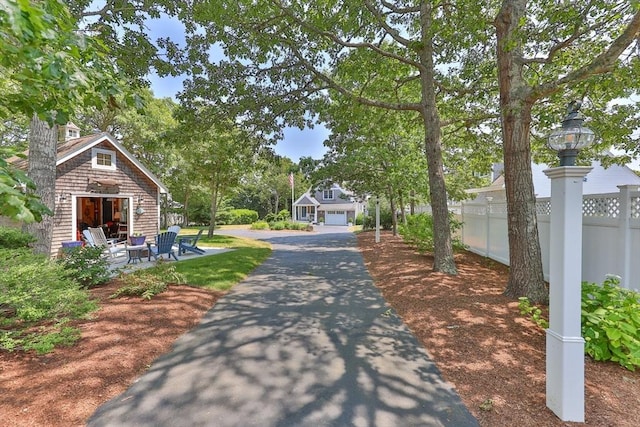 view of street with aphalt driveway