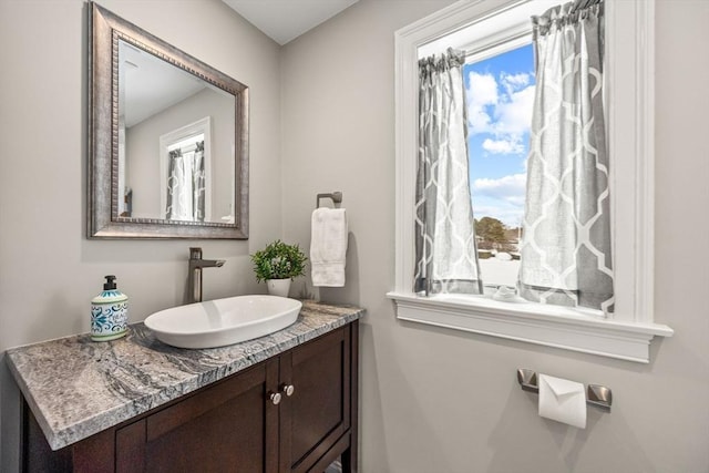 bathroom with a wealth of natural light and vanity