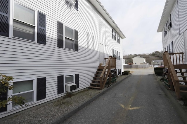 view of side of home with stairs