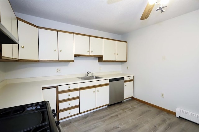 kitchen featuring a sink, white cabinets, light countertops, and stainless steel dishwasher