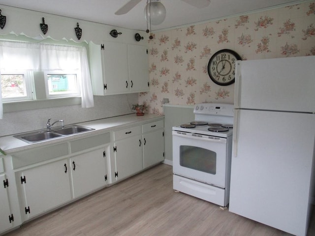 4 Aldrich Ave, Huntington, MA 01050 - kitchen featuring white appliances, a sink, wallpapered walls, light wood finished floors, and white cabinetry