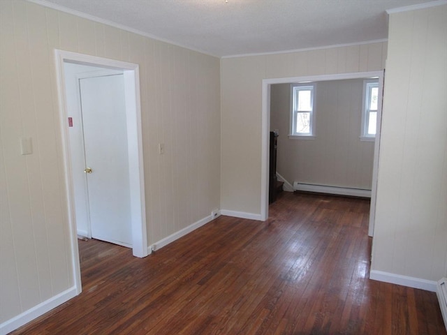 4 Aldrich Ave, Huntington, MA 01050 - spare room with baseboard heating, dark wood-type flooring, ornamental molding, and baseboards