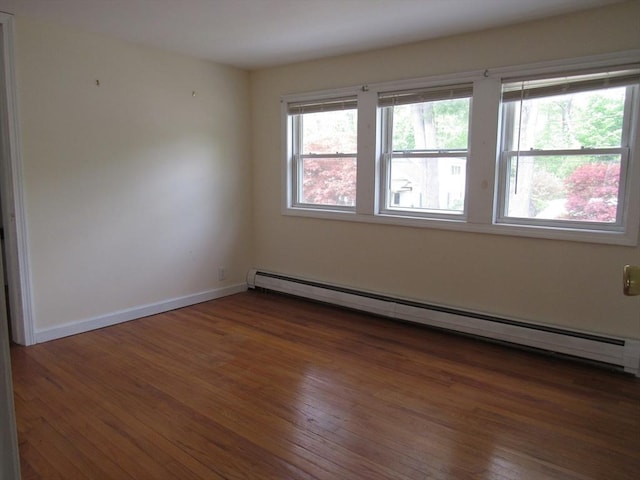 4 Aldrich Ave, Huntington, MA 01050 - empty room featuring baseboard heating, wood finished floors, and baseboards