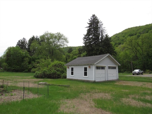4 Aldrich Ave, Huntington, MA 01050 - detached garage featuring a wooded view
