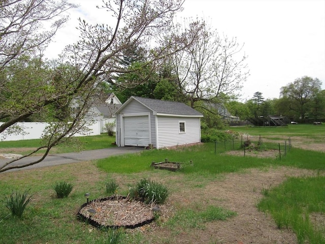 4 Aldrich Ave, Huntington, MA 01050 - view of yard featuring an outdoor structure, a garage, and asphalt driveway