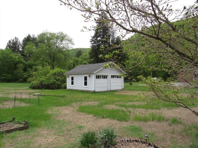 4 Aldrich Ave, Huntington, MA 01050 - view of grassy yard with a garage and an outbuilding