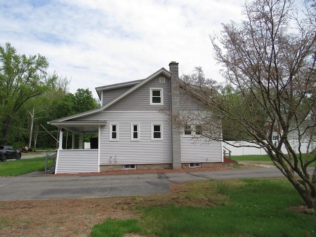 4 Aldrich Ave, Huntington, MA 01050 - back of property with a chimney