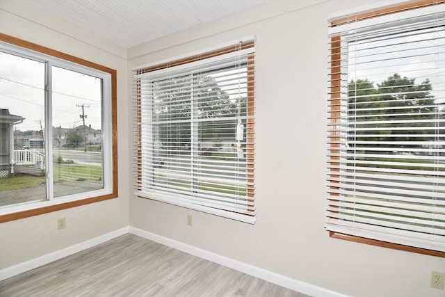 130 Center St, Ludlow, MA 01056 - empty room featuring healthy amount of natural light, light wood finished floors, and baseboards