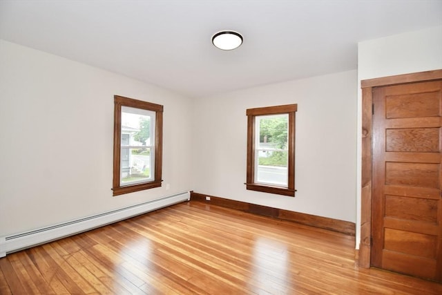 130 Center St, Ludlow, MA 01056 - spare room with a baseboard heating unit, plenty of natural light, light wood-style floors, and baseboards