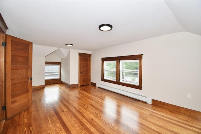 130 Center St, Ludlow, MA 01056 - bonus room featuring a baseboard heating unit, lofted ceiling, light wood finished floors, and baseboards