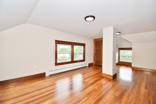 130 Center St, Ludlow, MA 01056 - additional living space featuring a baseboard heating unit, lofted ceiling, light wood finished floors, and baseboards