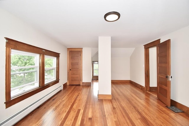 130 Center St, Ludlow, MA 01056 - additional living space featuring a baseboard radiator, light wood-type flooring, healthy amount of natural light, and baseboards