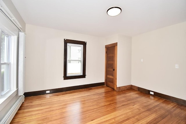 130 Center St, Ludlow, MA 01056 - unfurnished room with baseboard heating, light wood-style floors, baseboards, and plenty of natural light