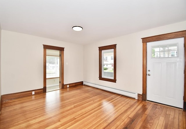 130 Center St, Ludlow, MA 01056 - foyer entrance with baseboard heating, plenty of natural light, and light wood-style floors